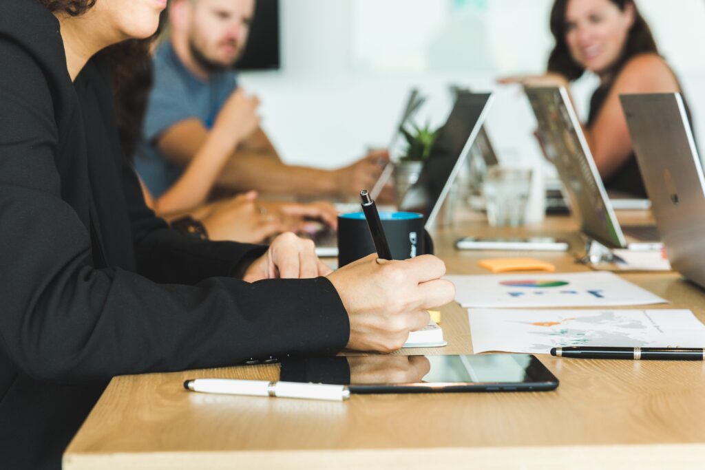woman-taking-notes-during-team-meeting